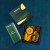Eco-friendly gifts in India featuring Honey-Tea gift hamper, handcrafted beeswax candles, Aipan art stationery, embroidered diary and upcycled incense cones