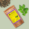 Tulsi Bliss Tea enjoyed in a calm setting — soothing adaptogenic herbal tea for body and mind.