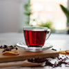 Cup of hibiscus herbal tea made with Pahari Haat Pure Hibiscus Petals — antioxidant-rich and refreshing.
