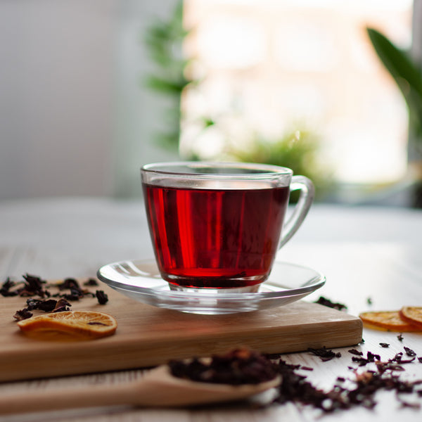 Cup of hibiscus herbal tea made with Pahari Haat Pure Hibiscus Petals — antioxidant-rich and refreshing.