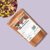 Eco-friendly pack of Pahari Haat Himalayan Blooms Tea — floral herbal blend for wellness.